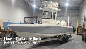 35 foot boat on a trailer inside the Simply Yachts enclosed boat repair facility.
